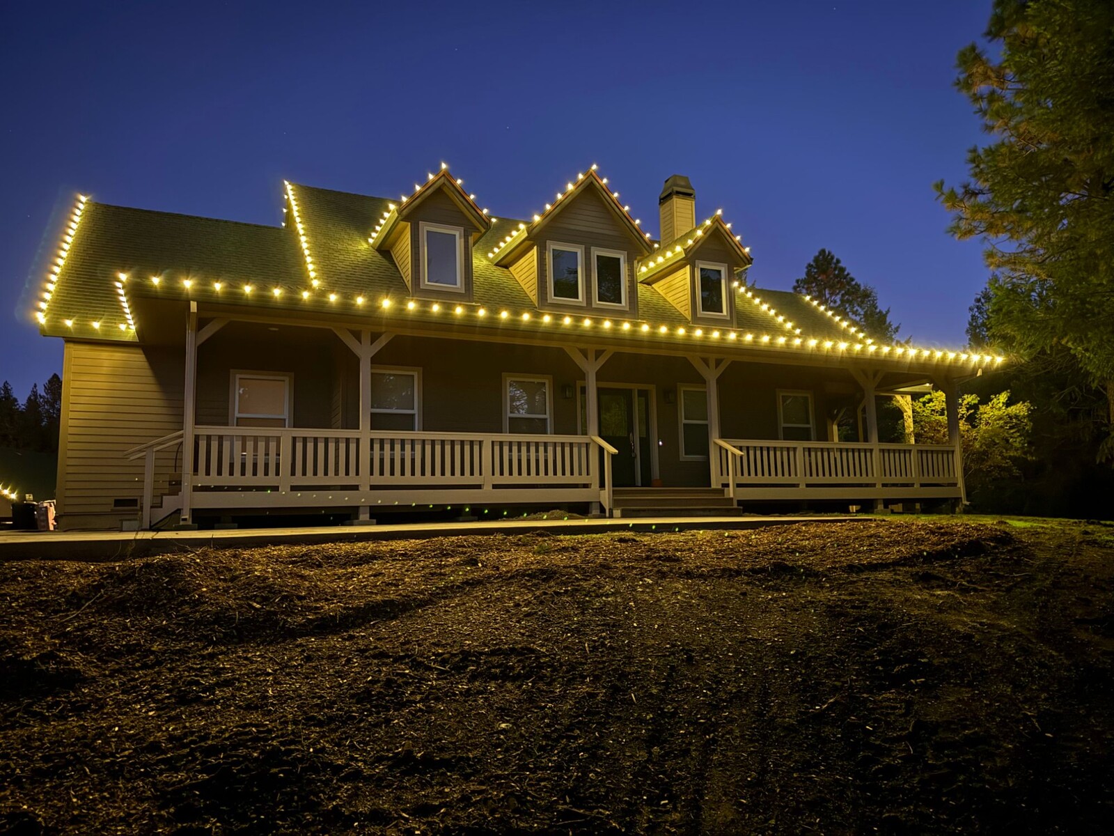 Christmas lights in Cameron Park, CA: country home three dormers warm white straight on