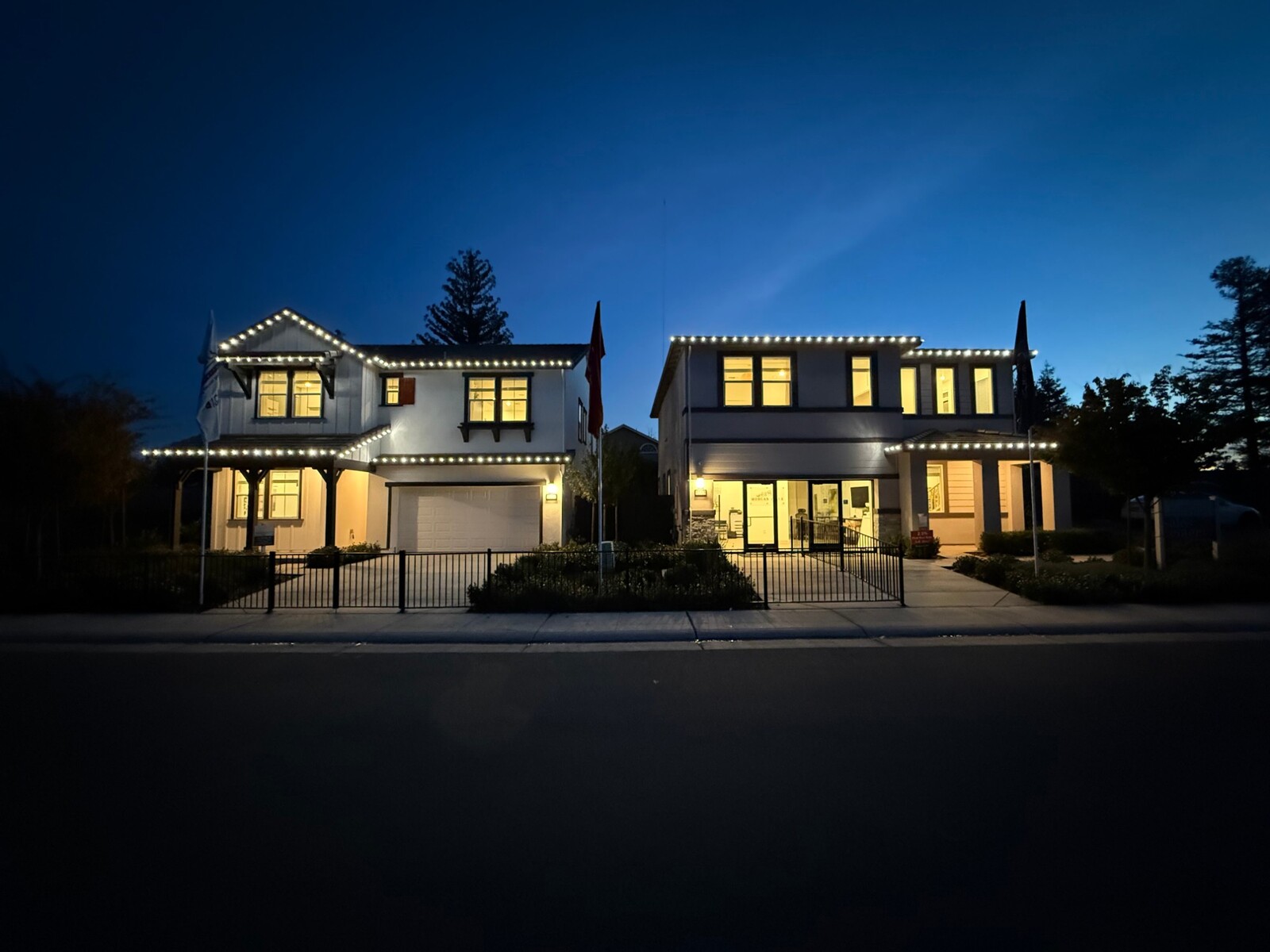 Professional christmas lights in Cameron Park, CA: two story home warm white roofline dusk